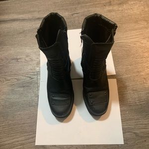 Leather platform boots. 3” heel, 1” on sole of foot. Reinforced piece on toe.